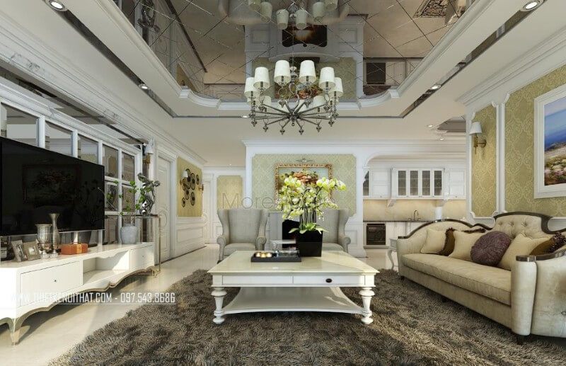 Nội thất phòng khách của chung cư tân cổ điển sử dụng hai tone màu chủ đạo là trắng và vàng nâu nhẹ giúp tạo nên sự hài hòa và ấn tượng tuyệt vời cho khu vực tiếp khách của gia chủ.
